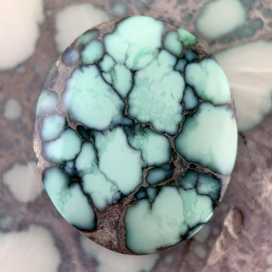 Polished variscite cabochon from the Calypso mine, Nevada