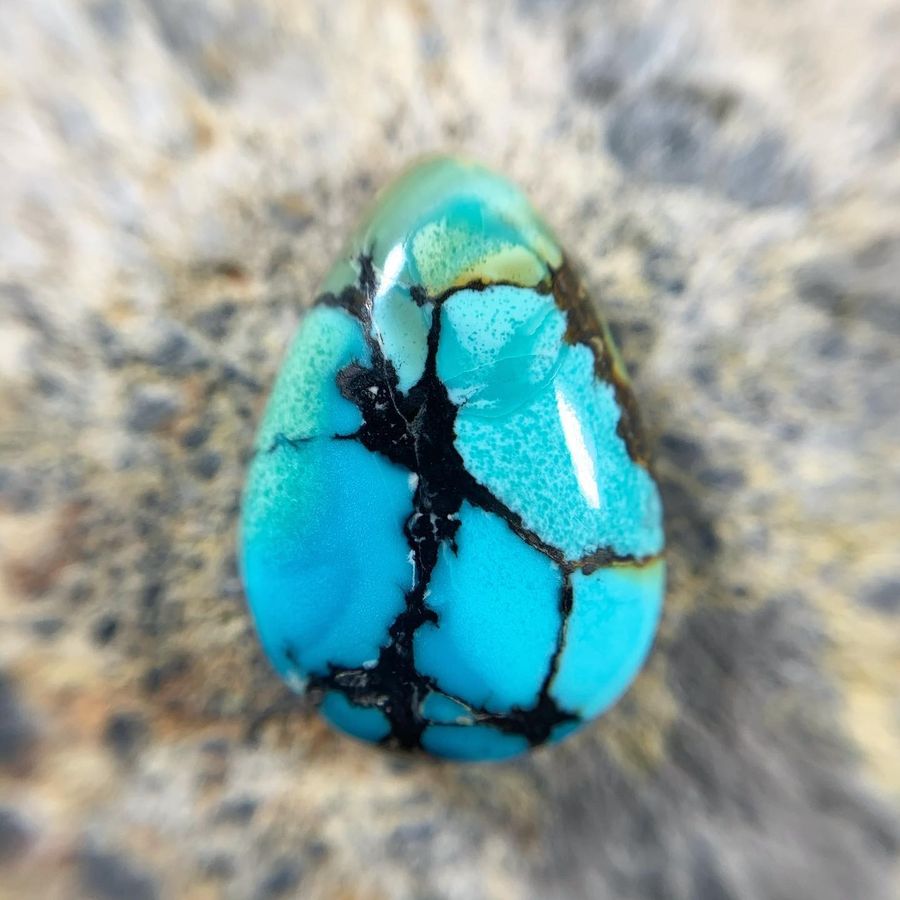 Polished turquoise cabochon from the Desert Springs mine, Nevada