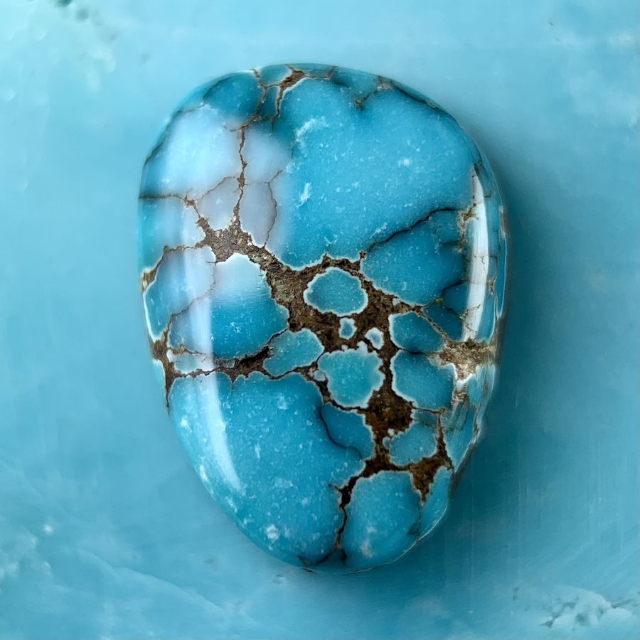 Polished turquoise cabochon from the Little Cristo mine, Nevada